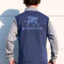 Person wearing a blue and gray jacket with 'WEALTH VOW' and a logo on the back.
